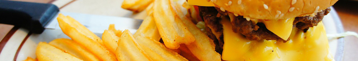 Eating Burger Fast Food at TX Burger restaurant in Madisonville, TX.